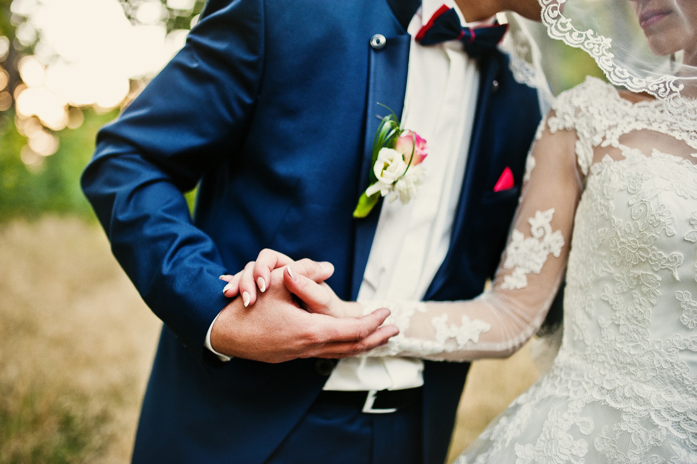 FormatFactoryhand-in-hand-of-stylish-wedding-couple-2022-01-26-16-24-07-utc